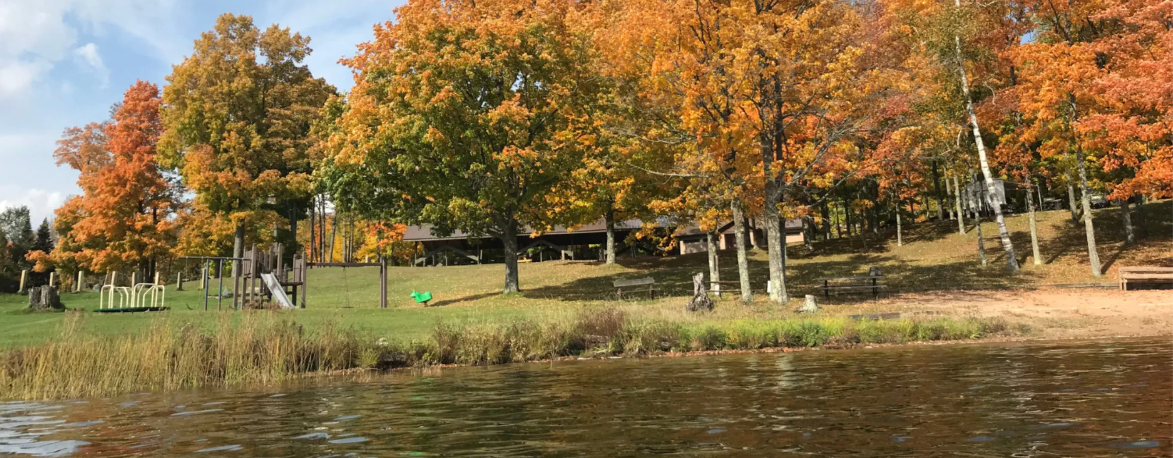 Newberg campground view of playground equipment and pavilion in fall from lake